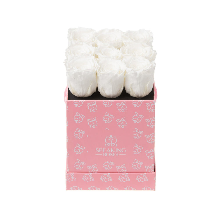 Pink box with white roses on a white background