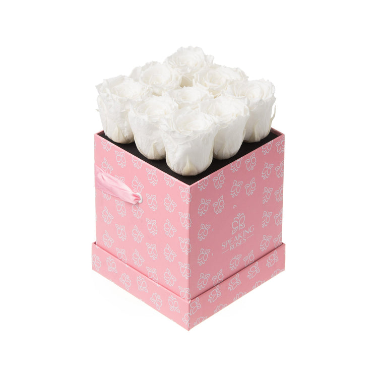 Pink gift box with white flowers on a white background
