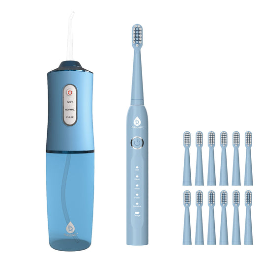 Blue electric toothbrush with multiple brush heads on a white background