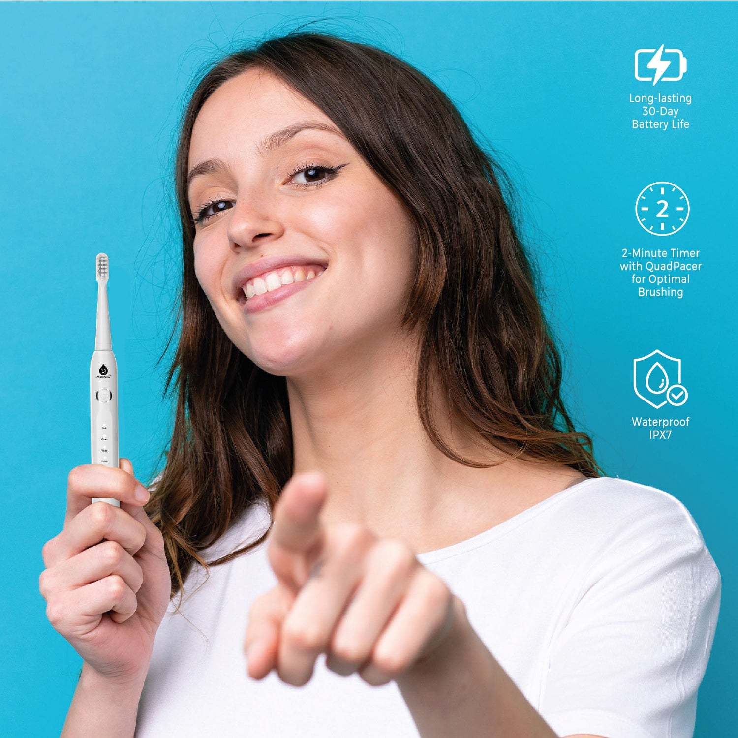Woman holding a white electric toothbrush with product features on a blue background