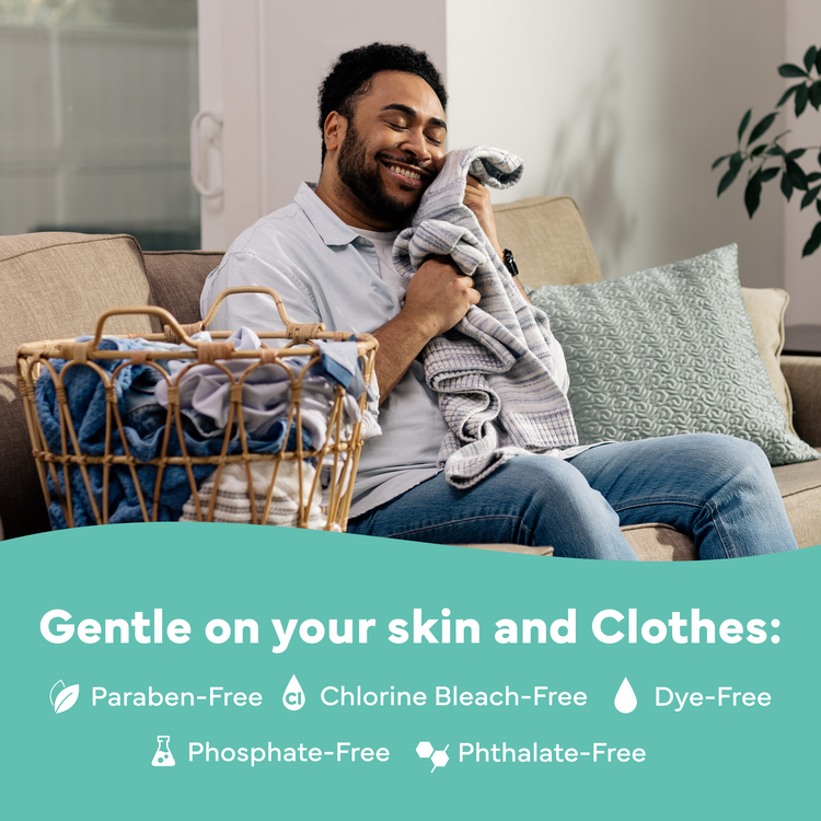 Man sitting on a couch with a basket of laundry, smiling, with text about product benefits.