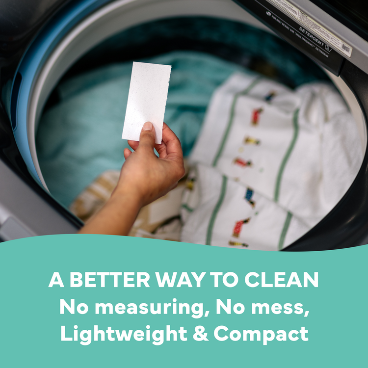 Hand holding a white cloth in front of an open washing machine with text about a better cleaning method.