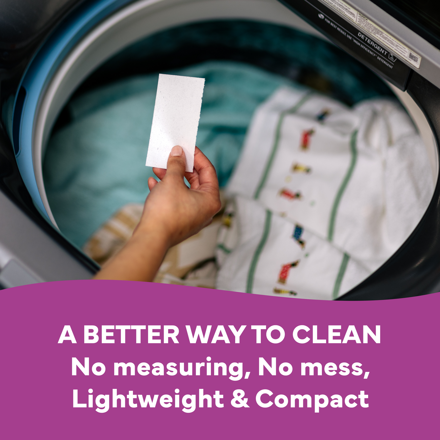 Hand holding a white card in front of a washing machine with text about a better cleaning method.