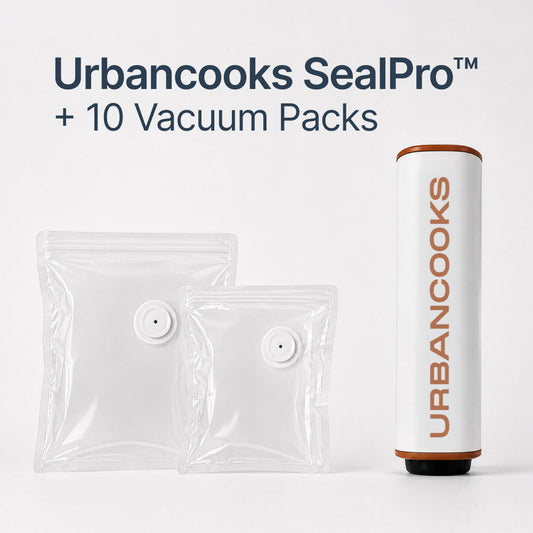 Urbancooks SealPro vacuum sealer shown with two clear vacuum packs and a white cylindrical sealer canister printed with the Urbancooks brand name, on a clean white background with text reading 'Urbancooks SealPro + 10 Vacuum Packs'.