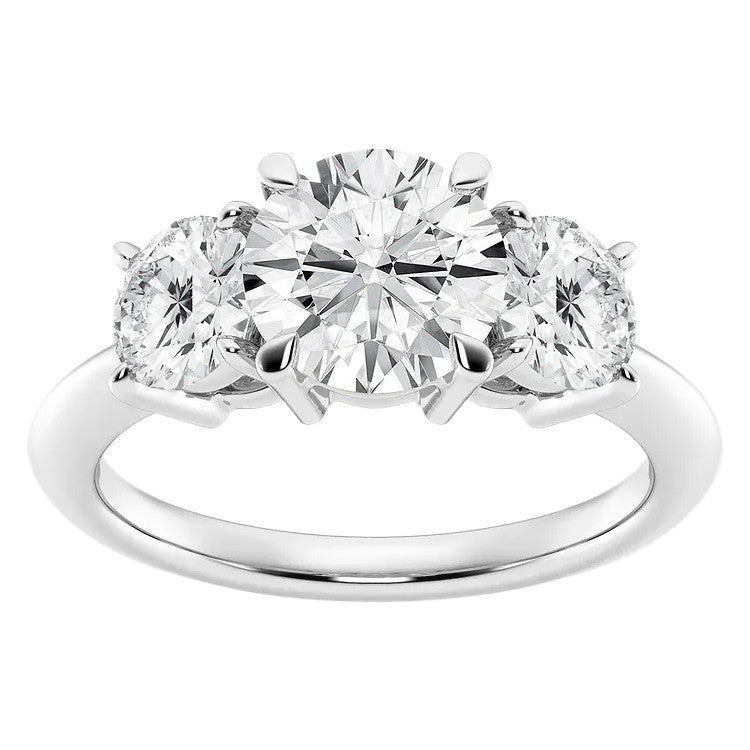 Three-stone diamond ring on a white background