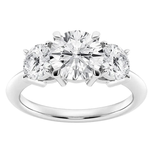 Three-stone diamond ring on a white background