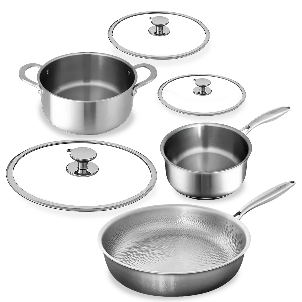 Set of stainless steel cookware including pots, pans, and lids on a white background