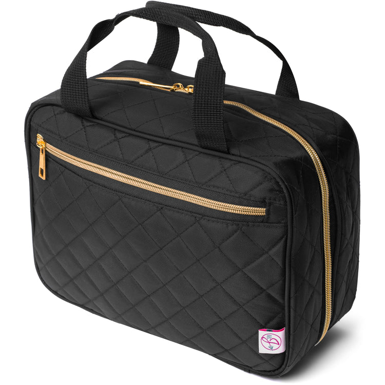 Black quilted bag with gold zippers on a white background