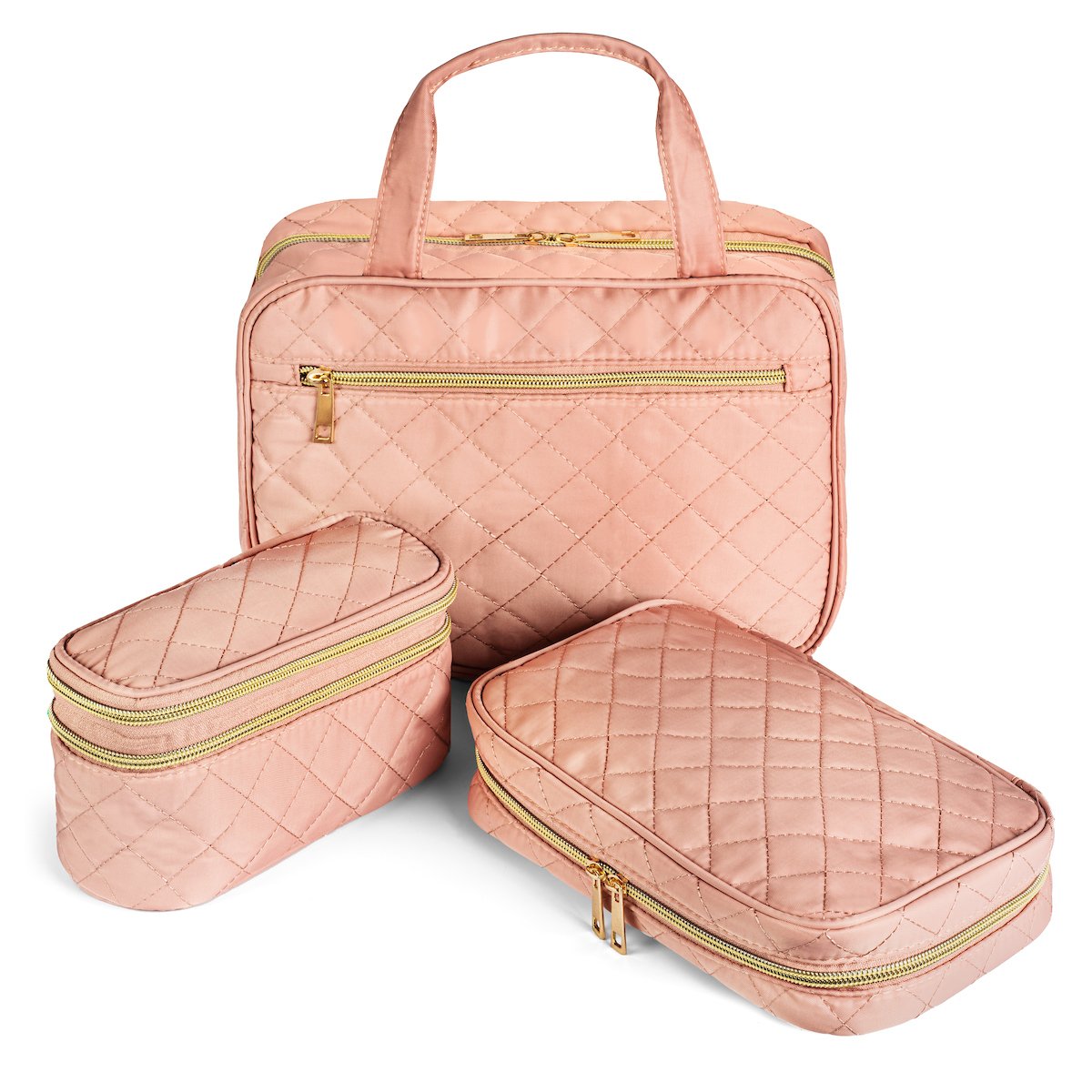 Set of three pink quilted travel bags with gold zippers on a white background