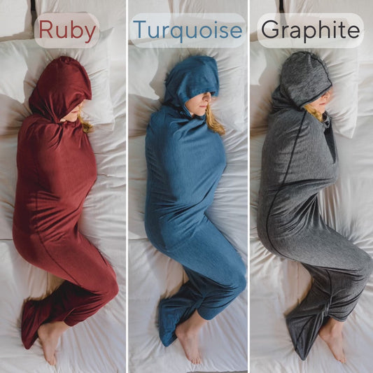 Turquoise#man in Sleep Pod Hood in bed laying down