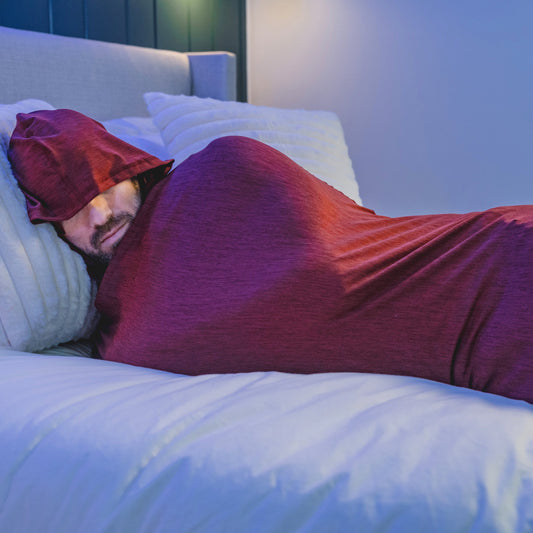 Turquoise#man in Sleep Pod Hood in bed laying down