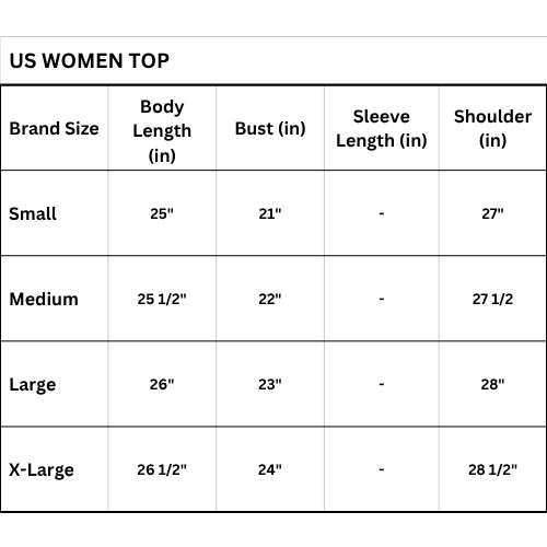 Woman wearing navy blue pajama set in a bedroom and bathroom setting.