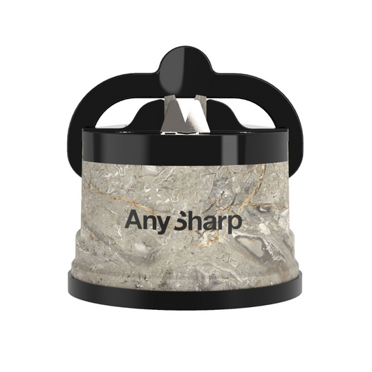 A black AnySharp Knife Sharpener with a suction cup base and a metallic sharpening element, positioned on a neutral background.