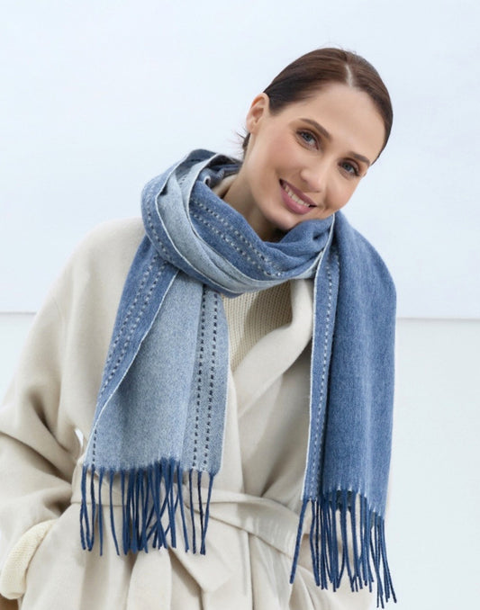 Woman wearing a blue scarf with a white background