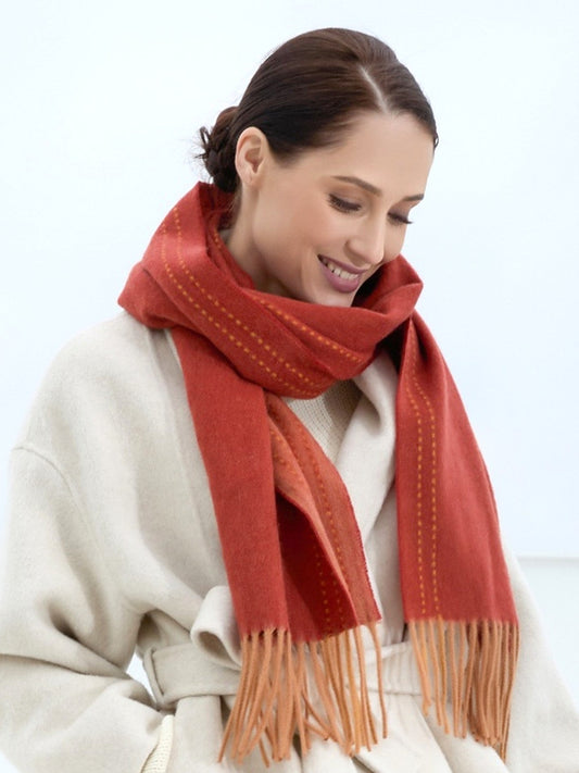 Woman wearing a red scarf with a white background