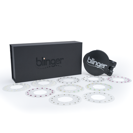 A blinger Vanity Starter Set with a styling tool and a circle of precision-cut glass crystals inside a deluxe black vanity storage case.