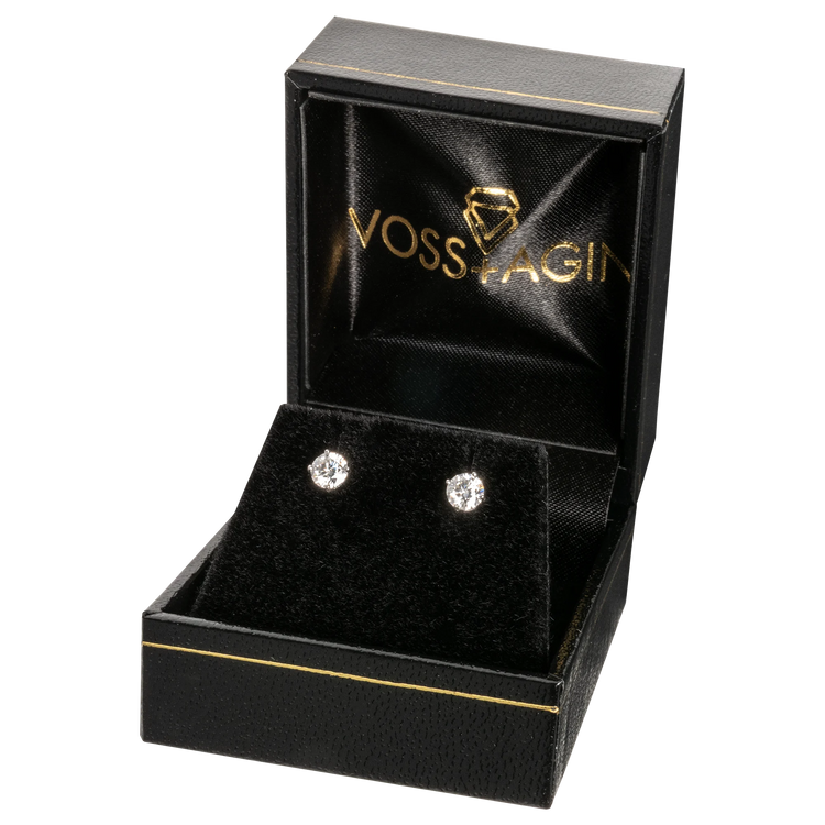 Black jewelry box with 'VOSS & AGIN' branding containing a pair of diamond earrings.