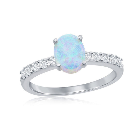 Silver ring with a central opal stone and diamond accents on a white background