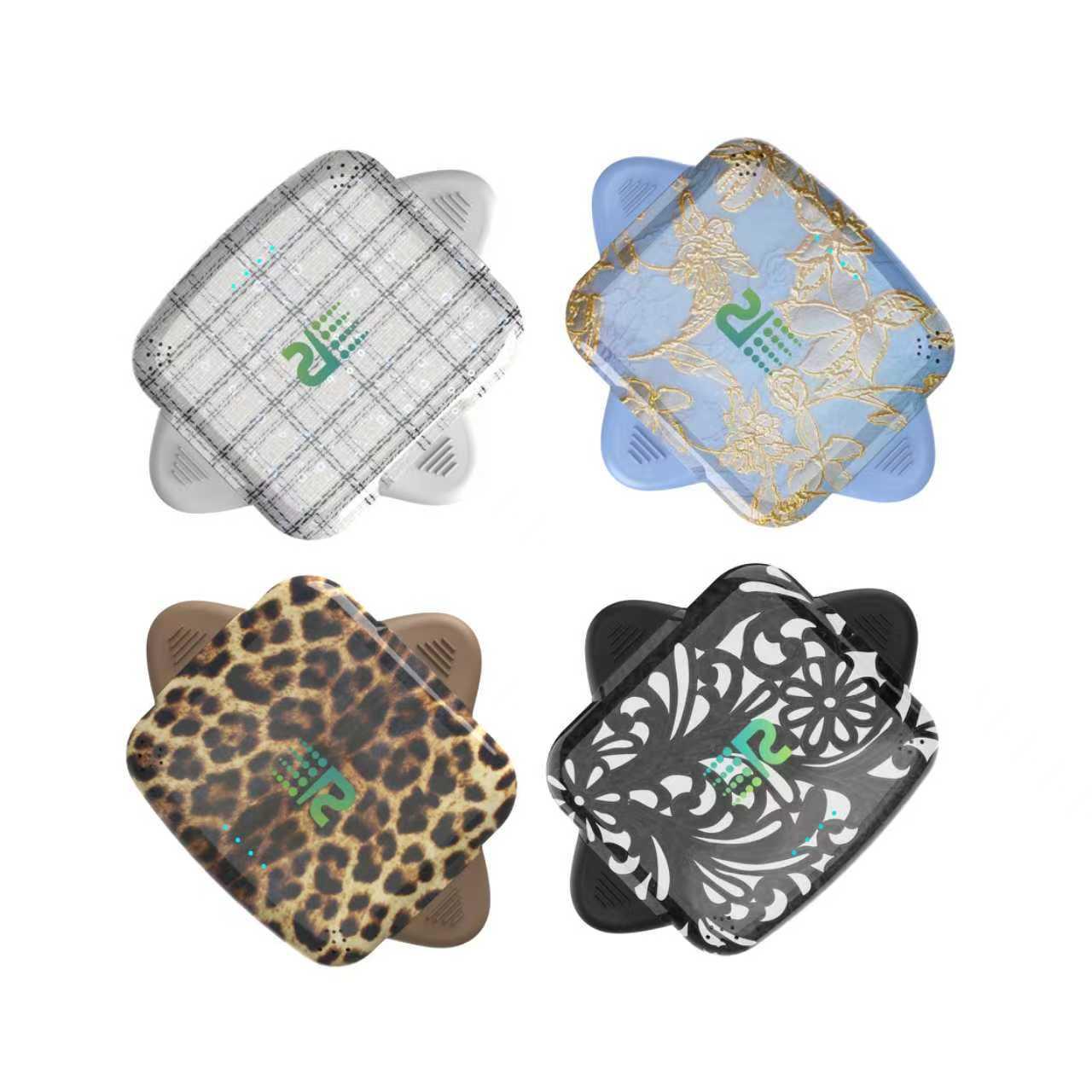Four square coasters with different patterns on a white background