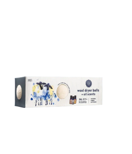 Box of wool dryer balls with oil scents on a gray background