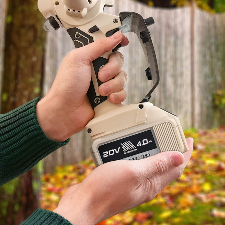 Hand holding a cordless power tool with a blurred outdoor background