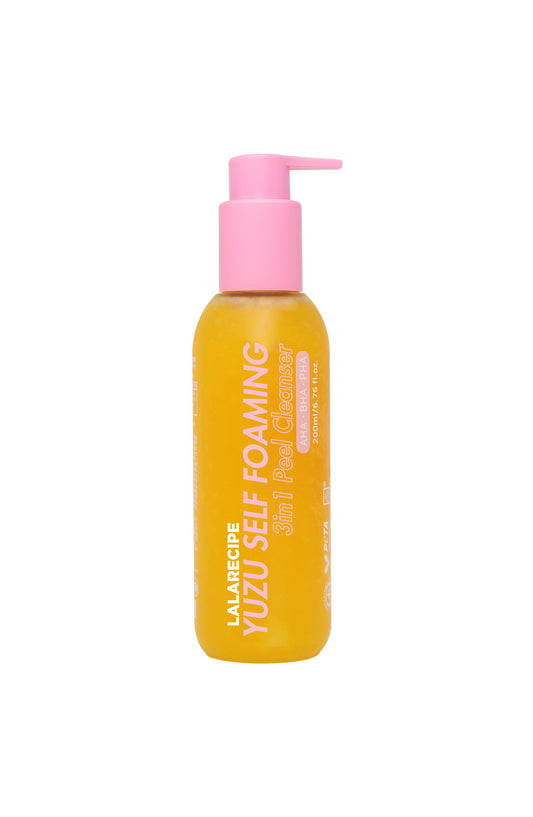 A bottle of LALARECIPE Yuzu Self Foaming 3-in-1 Peel Cleanser with a bright yellow-orange liquid and a pink pump dispenser, shown on a plain white background.