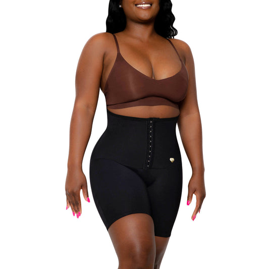 Person wearing a black shapewear garment on a white background