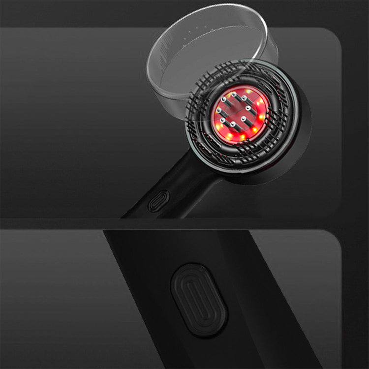 Close-up of a black device with a red light on a dark background