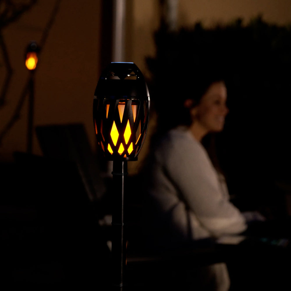 Decorative outdoor light with a person sitting in the background