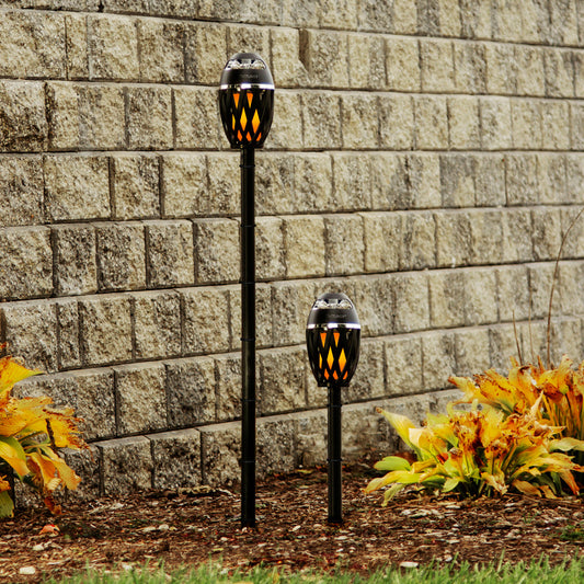 Black and orange outdoor speaker with TIKITUNES branding on a white background with music notes.