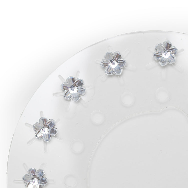 Clear rhinestone flowers on a round clear plastic sheet