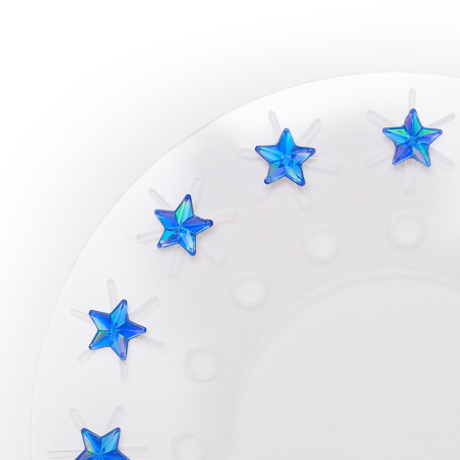 Blue star-shaped earrings on a white background