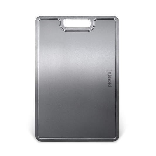 Gray cutting board with a handle on a white background