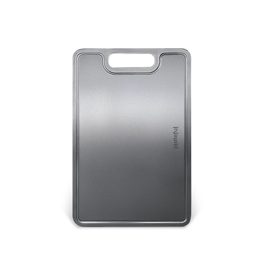 Gray cutting board with a handle on a white background