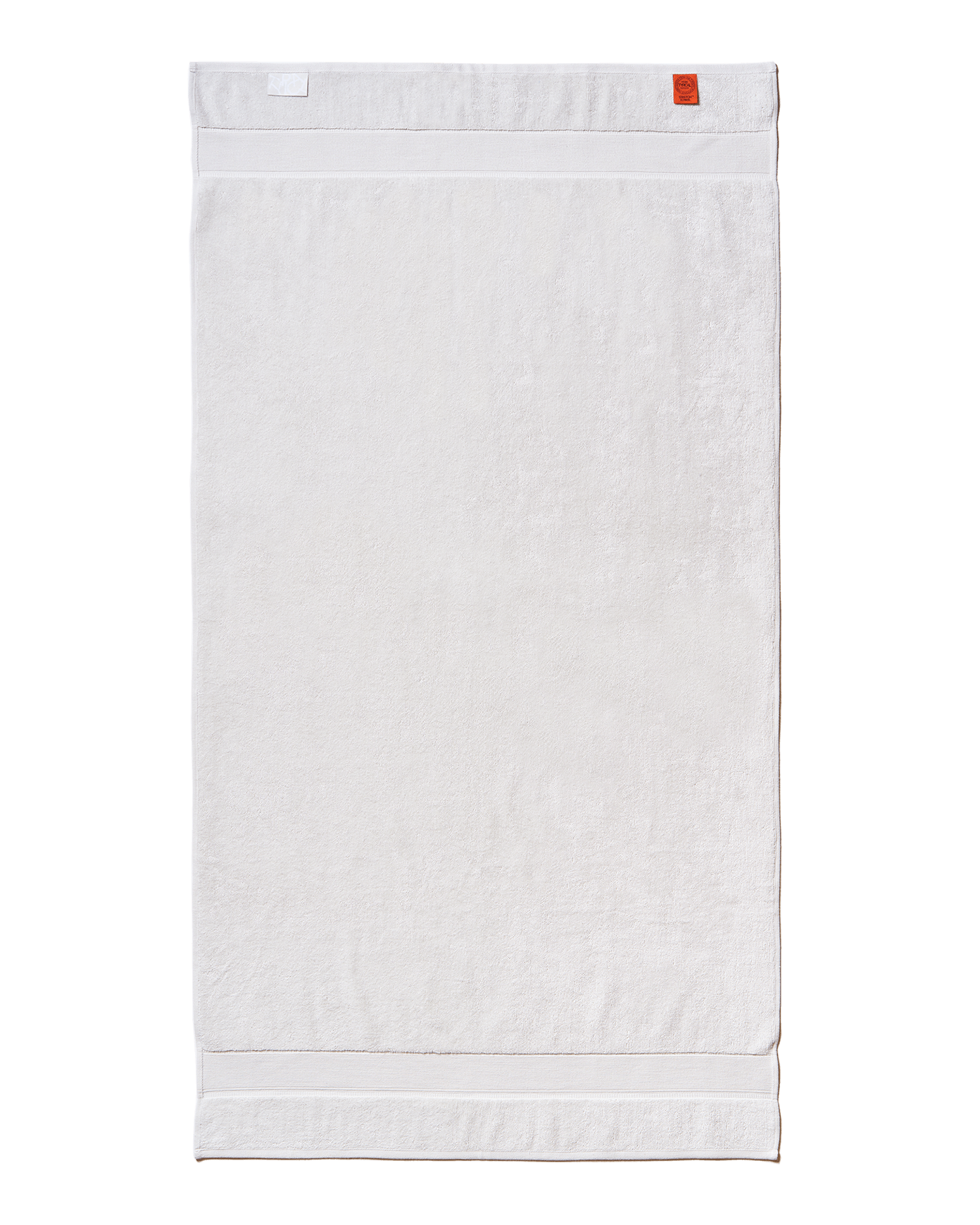 White towel with a red label on a black background