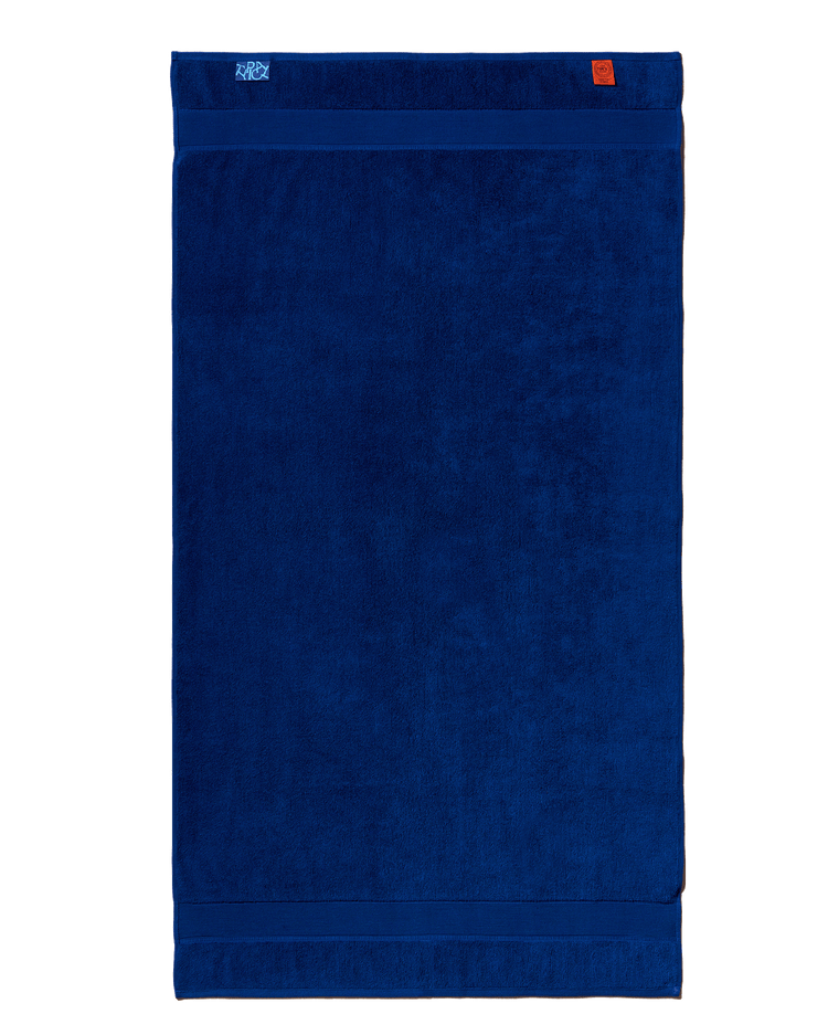 Blue towel with a brand logo on a white background