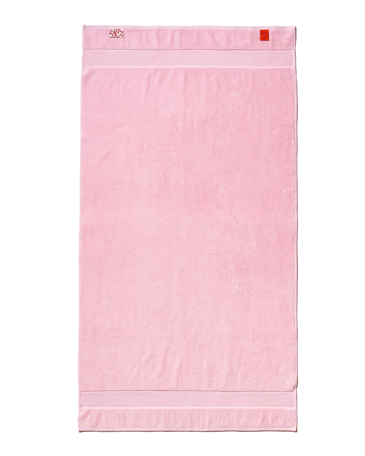 Pink towel with white border on a white background