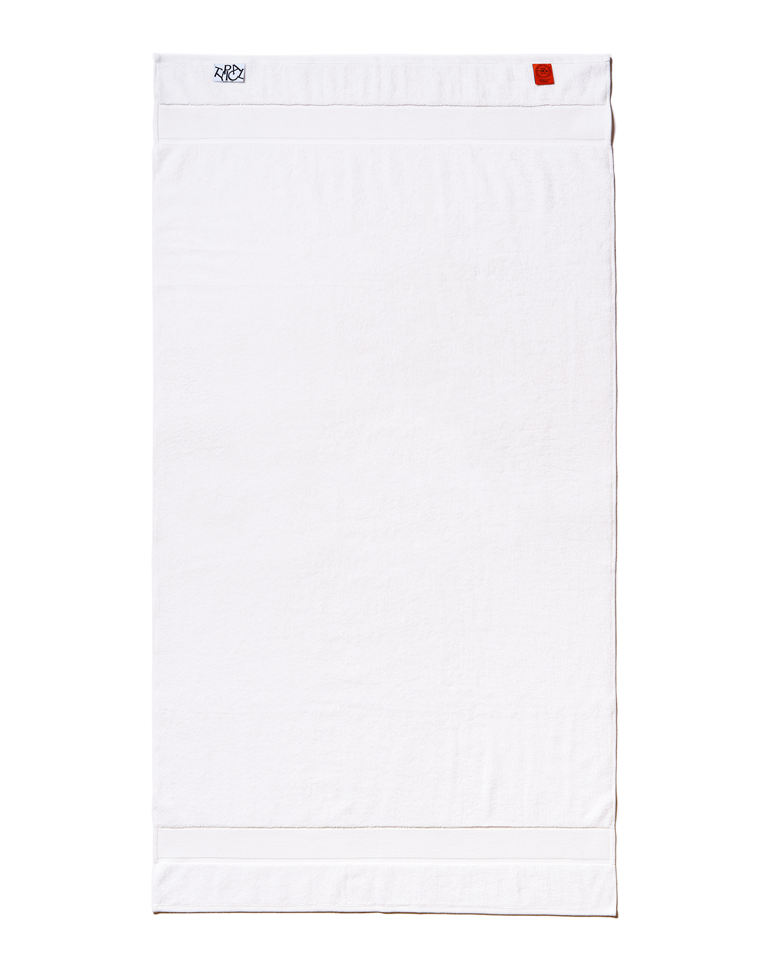White towel with a brand logo on a black background