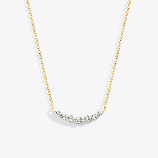 Gold necklace with small diamonds on a white background