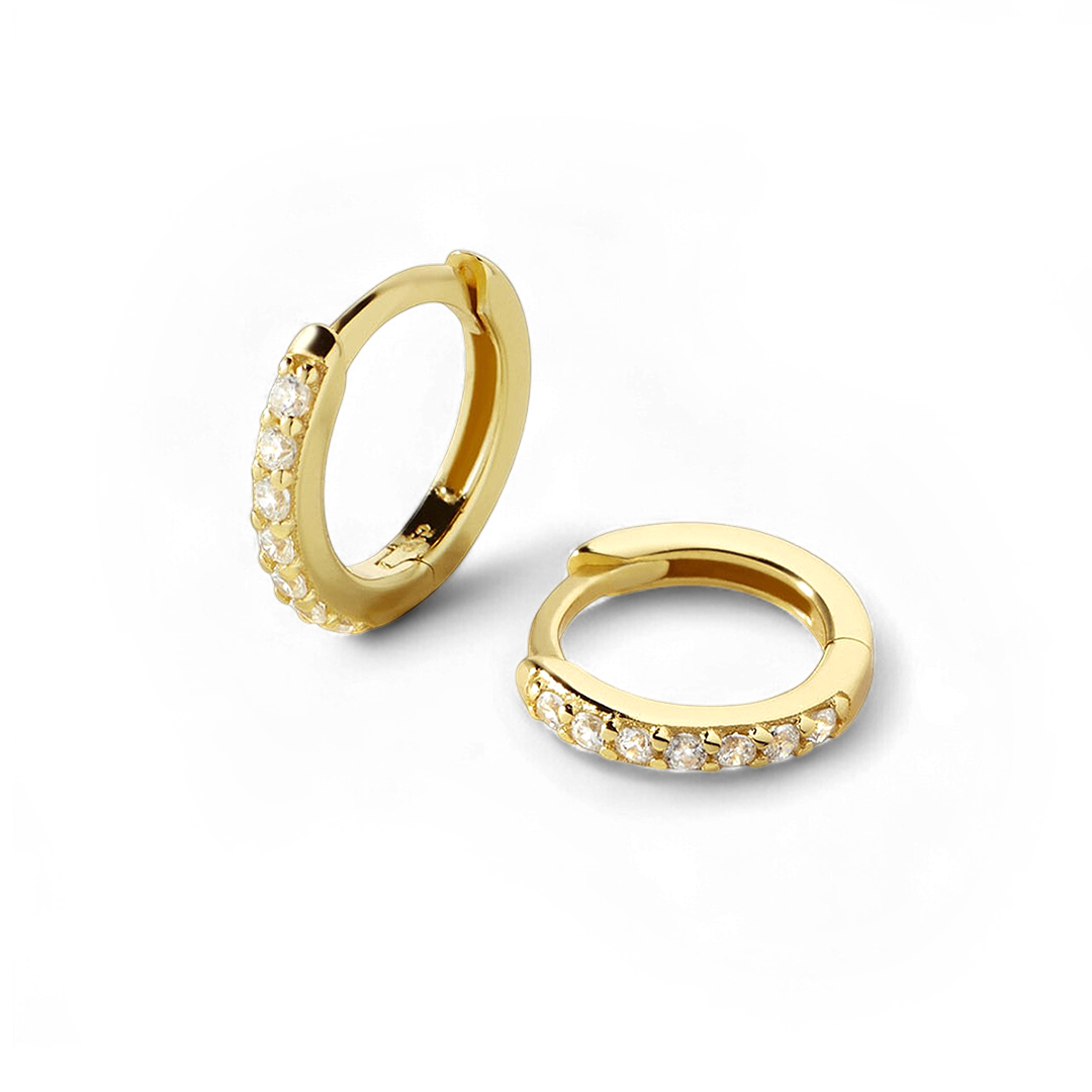 Gold hoop earrings with small diamonds on a white background