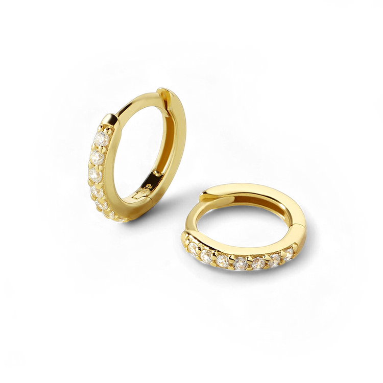 Gold hoop earrings with small diamonds on a white background
