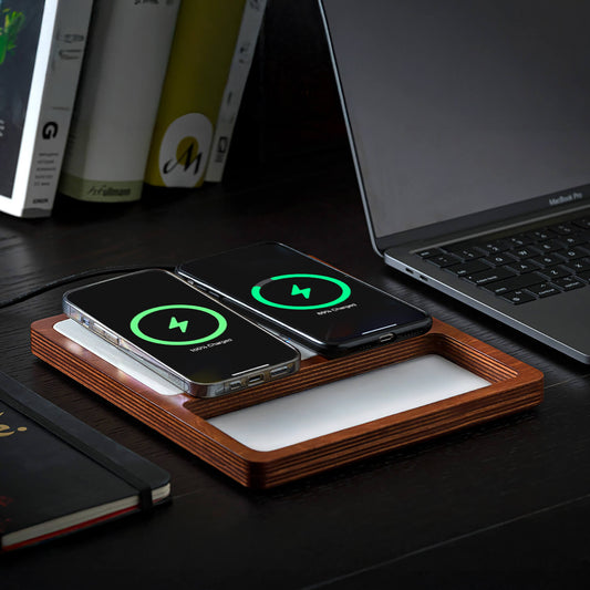 A wireless charging pad with a compartment for charging AirPods or small devices, and another for a smartphone, with a smartphone on top indicating charging status.