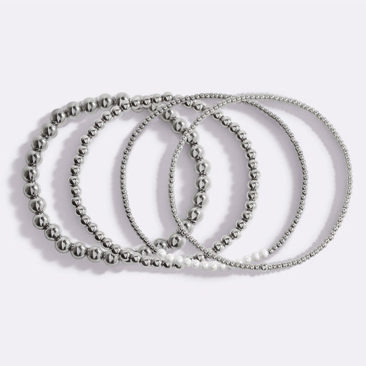 Silver beaded bracelet on a light gray background