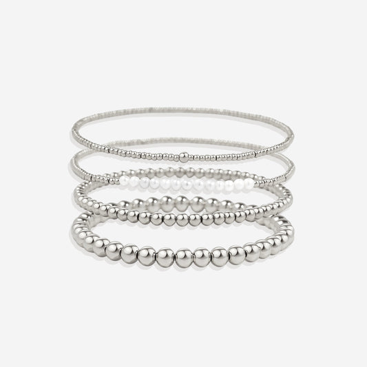 Silver beaded bracelet on a light gray background