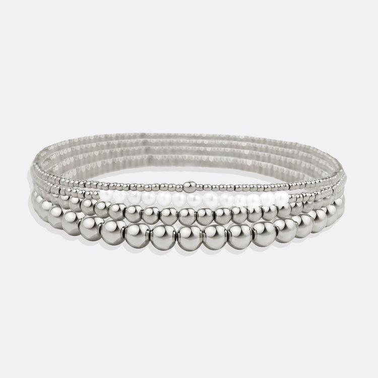 Silver beaded bracelet on a light gray background