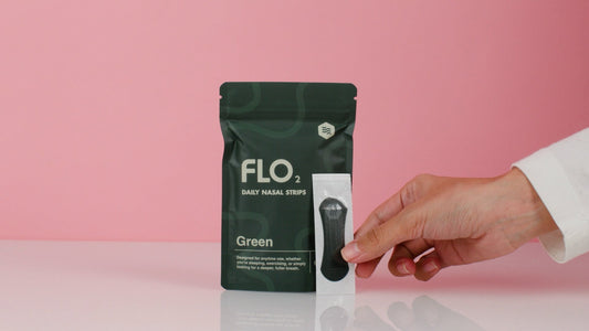 Green package of FLO2 daily nasal strips on a white background