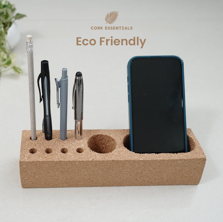 Cork desk organizer with phone and pens, branded 'Cork Essentials'.