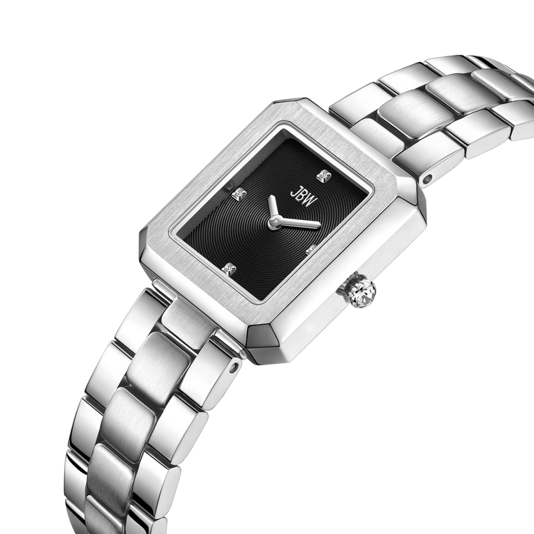 A silver rectangular JBW Watches Arc Single (J6390G-GA) with a black dial, minimalist markers, and metal link band rests on a white background. The brand name is visible on this sleek, gender-neutral timepiece.