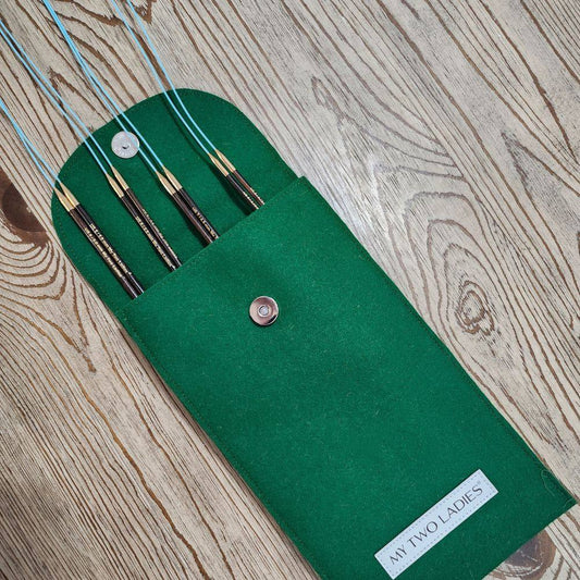 Knitting needles set with packaging on a white background