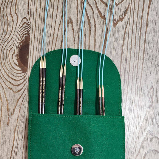 Knitting needles set with packaging on a white background